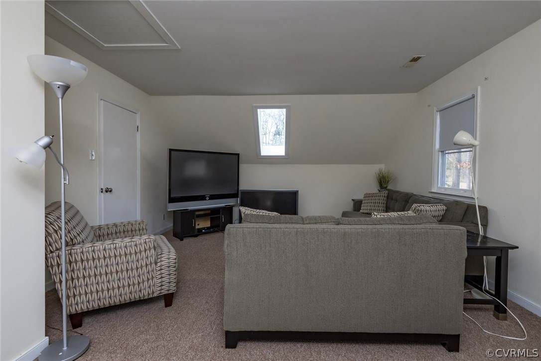 5009 Tulip Oak Road Chesterfield, VA 23832 - Photo 23 of 35 a living room with furniture and a flat screen tv