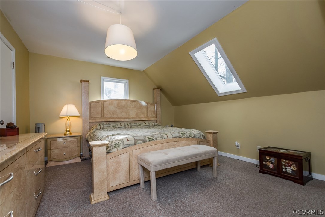 5009 Tulip Oak Road Chesterfield, VA 23832 - Photo 26 of 35 a bedroom with a bed and a lamp on table