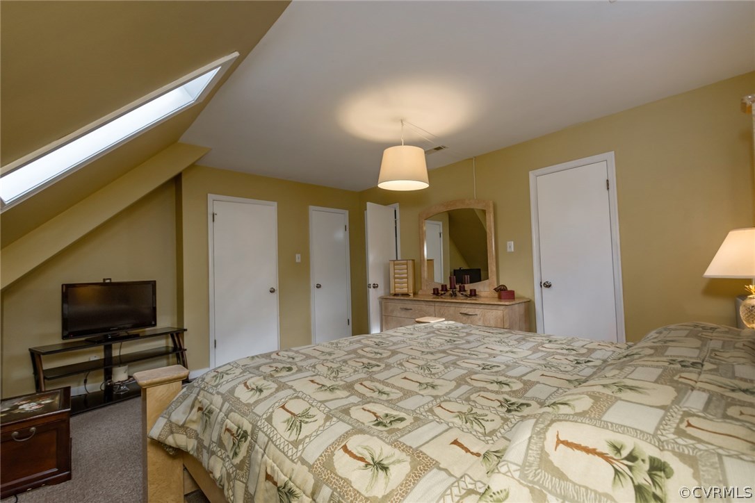 5009 Tulip Oak Road Chesterfield, VA 23832 - Photo 28 of 35 a bedroom with a bed and a flat screen tv