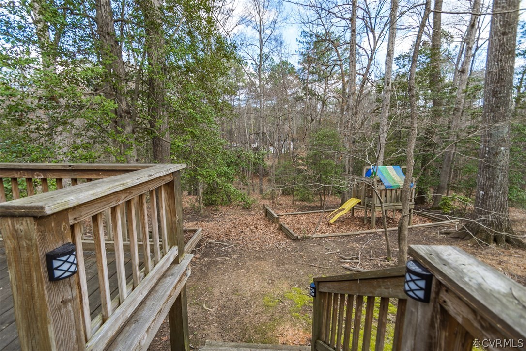 5009 Tulip Oak Road Chesterfield, VA 23832 - Photo 35 of 35 a view of a wooden deck and a backyard
