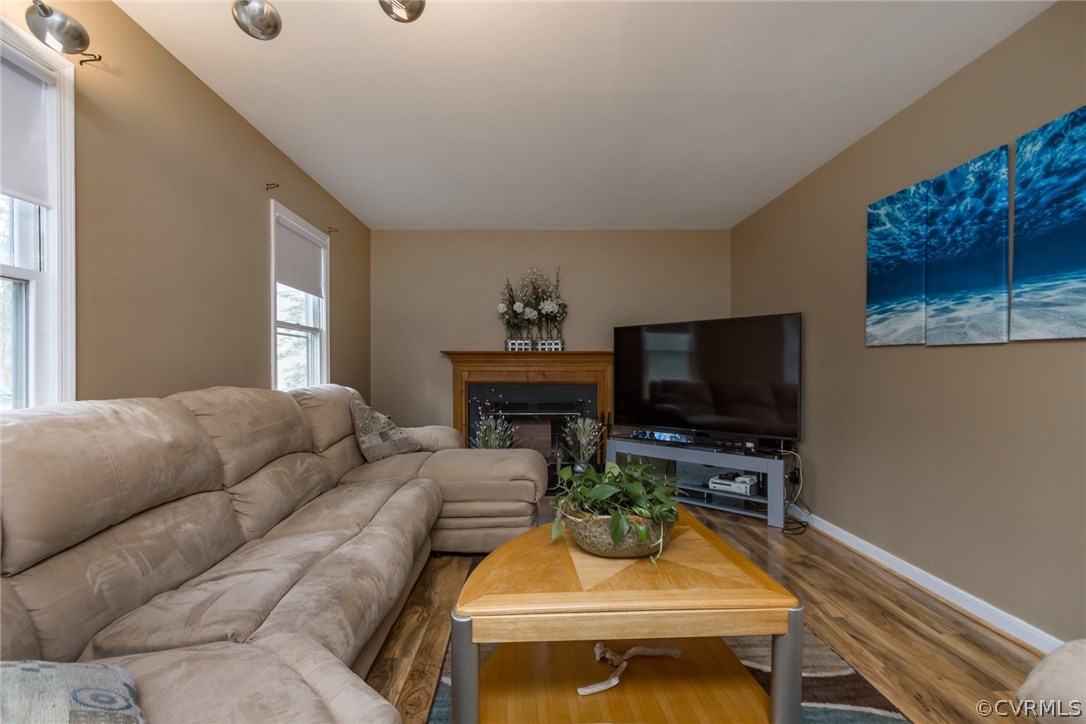 5009 Tulip Oak Road Chesterfield, VA 23832 - Photo 4 of 35 a living room with furniture and a flat screen tv