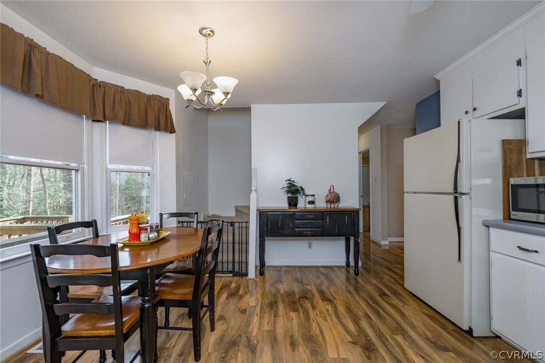 5009 Tulip Oak Road Chesterfield, VA 23832 - Photo 7 of 35 a view of a dining room with furniture window and wooden floor