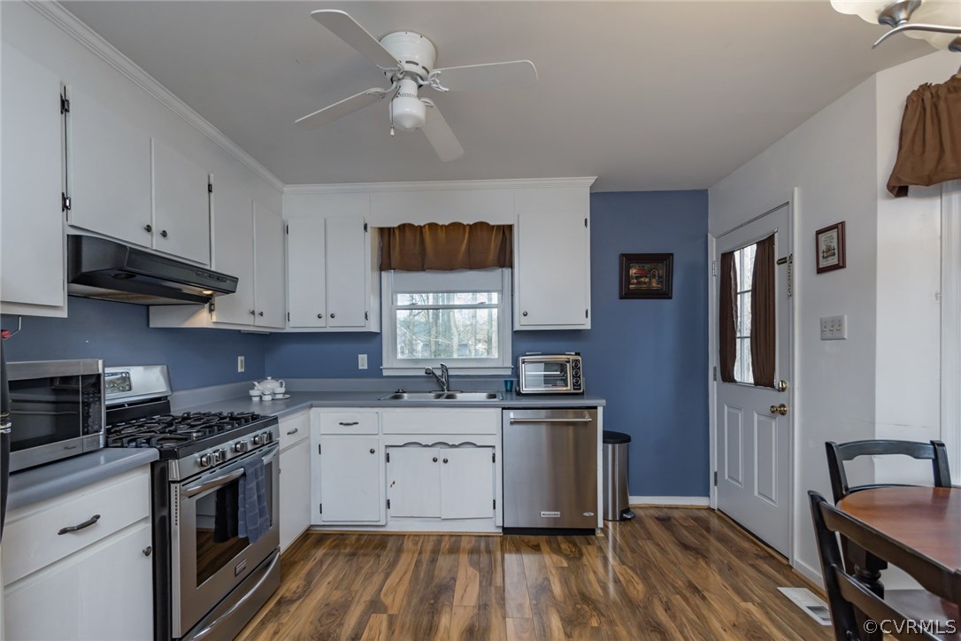 5009 Tulip Oak Road Chesterfield, VA 23832 - Photo 10 of 35 a kitchen with stainless steel appliances granite countertop a stove a sink dishwasher and a refrigerator with wooden floor