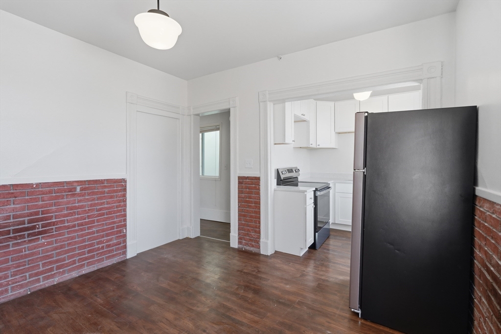 105 High Street, Unit 4P Holyoke, MA 01040 - Photo 3 of 11 a view of kitchen with wooden floor