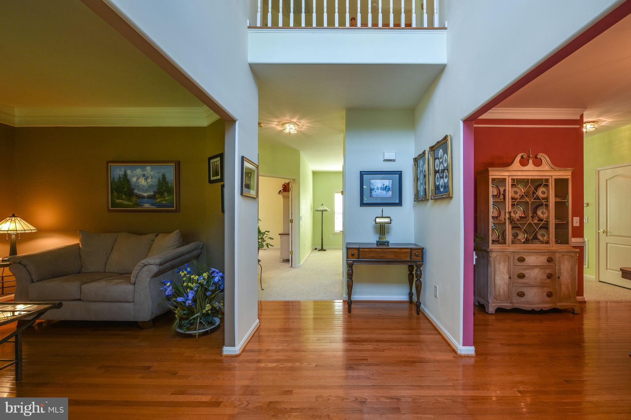 6865 North Stuart Road King George, VA 22485 - Photo 2 of 30 a living room with furniture and a wooden floor