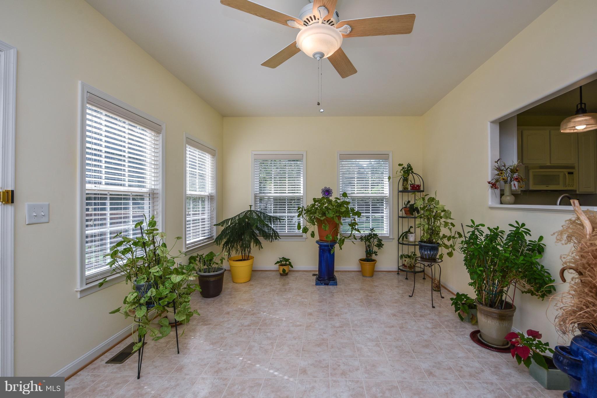 6865 North Stuart Road King George, VA 22485 - Photo 11 of 30 a view of a livingroom with furniture and a potted plant