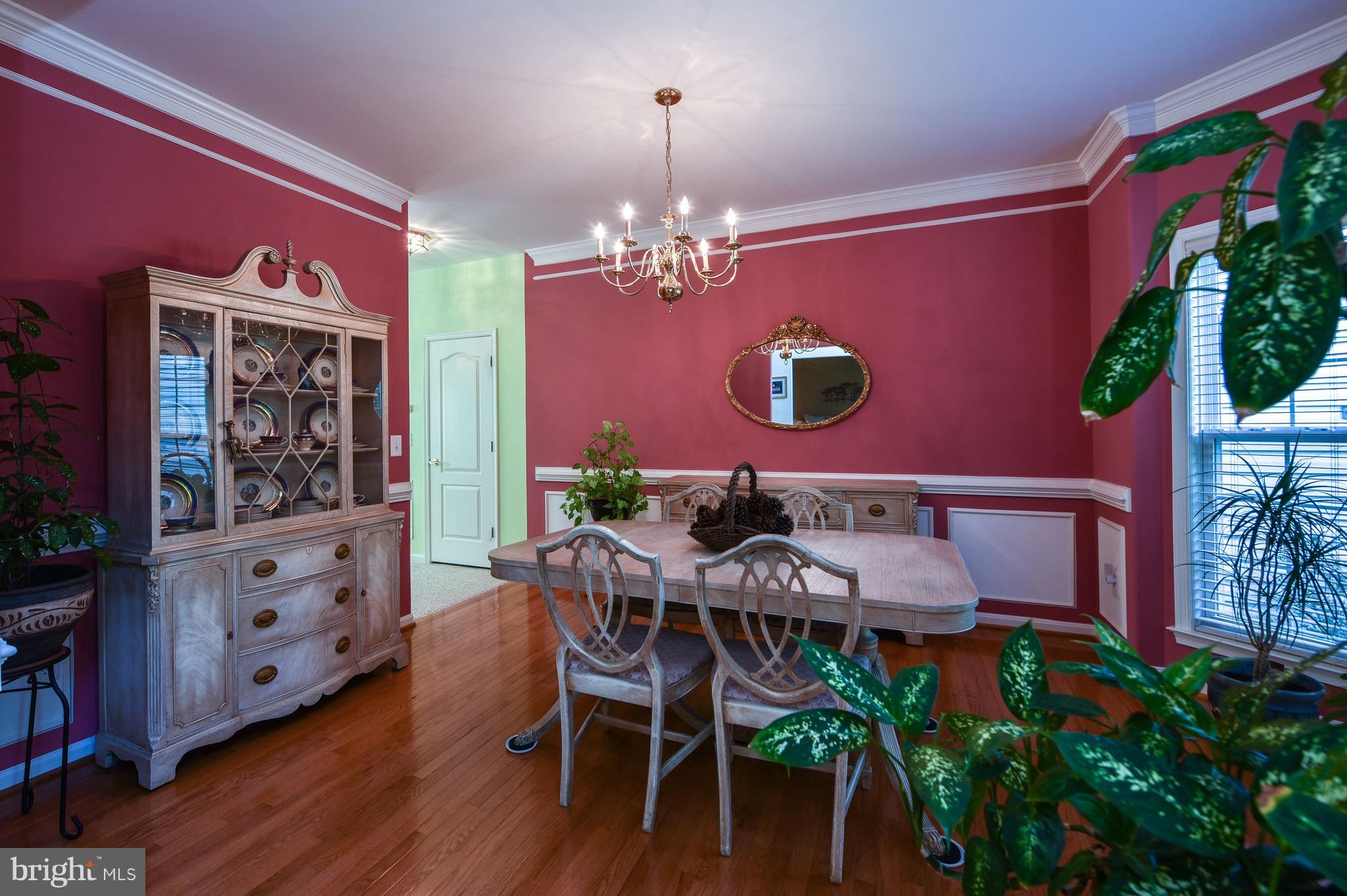 6865 North Stuart Road King George, VA 22485 - Photo 3 of 30 a view of a dining room with furniture and wooden floor