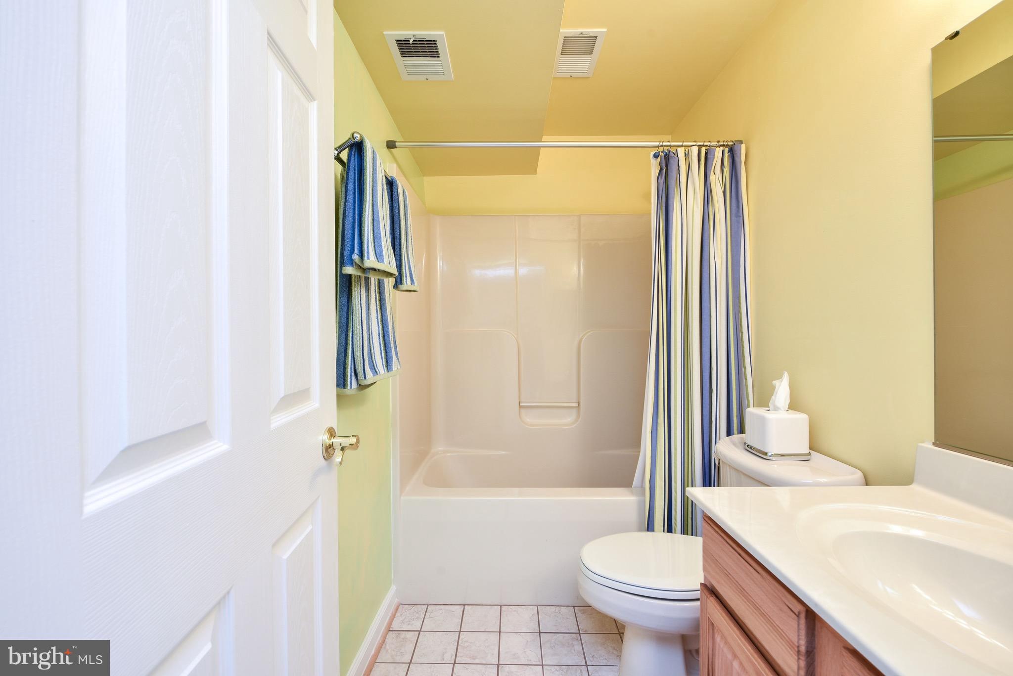 6865 North Stuart Road King George, VA 22485 - Photo 25 of 30 a bathroom with a granite countertop sink toilet and shower