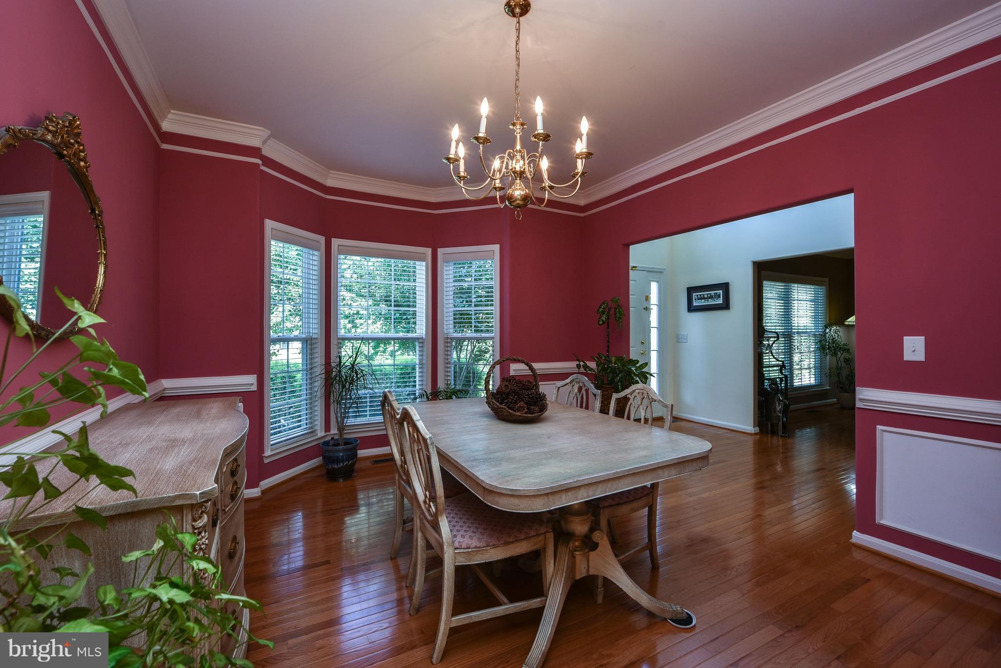 6865 North Stuart Road King George, VA 22485 - Photo 4 of 30 a view of a dining room with furniture window and wooden floor