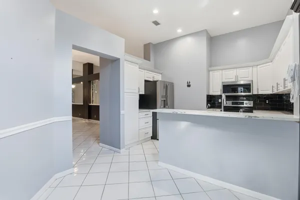 a view of washer and dryer near a kitchen
