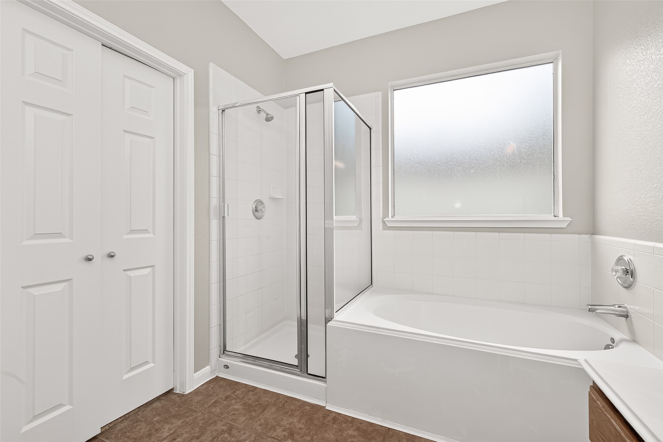 21327 Bella Flora Court Spring, TX 77379 - Photo 25 of 50 a bathroom with a bathtub and a shower