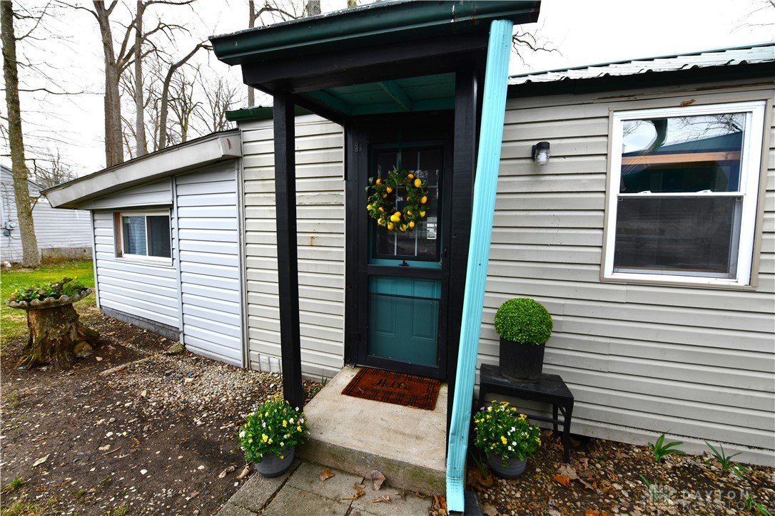 5445 Behm Road, Unit 15 Celina, OH 45822 - Photo 35 of 49 This charming home offers a welcoming facade with a covered porch and simple landscaping.