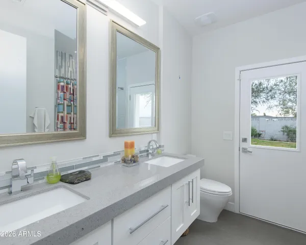 a view of a workspace with furniture and a gate