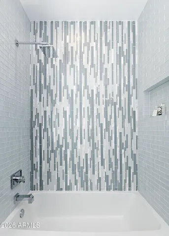 a bathroom with a granite countertop sink a toilet and a mirror