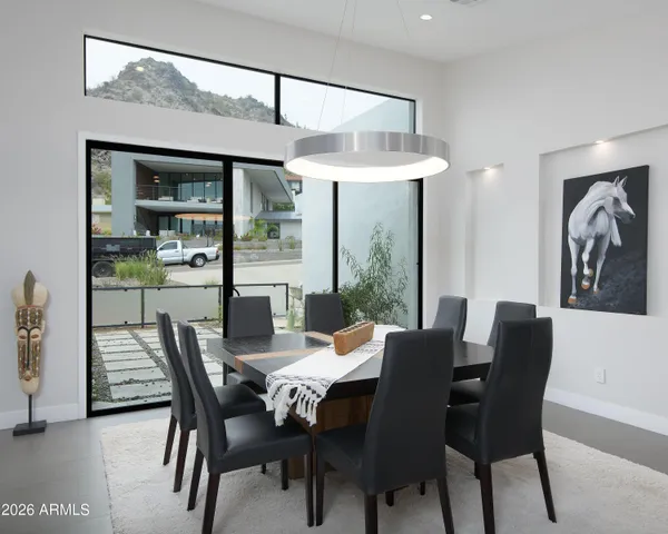 a view of a dining room with furniture window and outside view