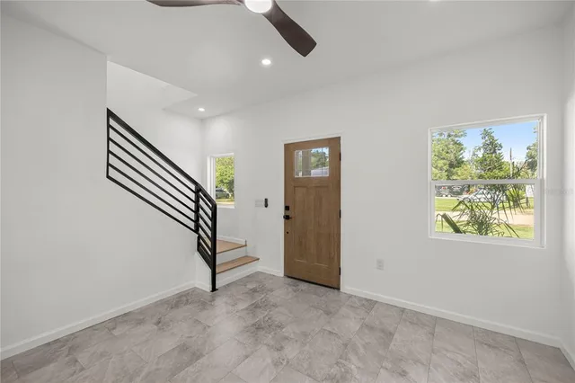 an entryway in a hall with a window