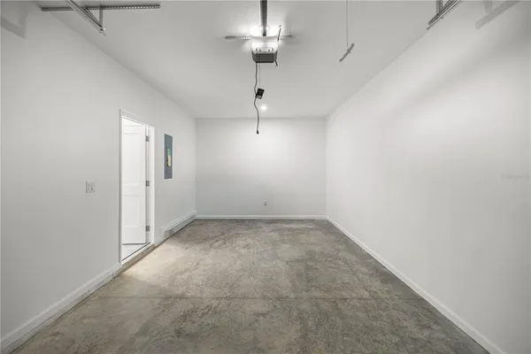 a view of empty room with ceiling fan