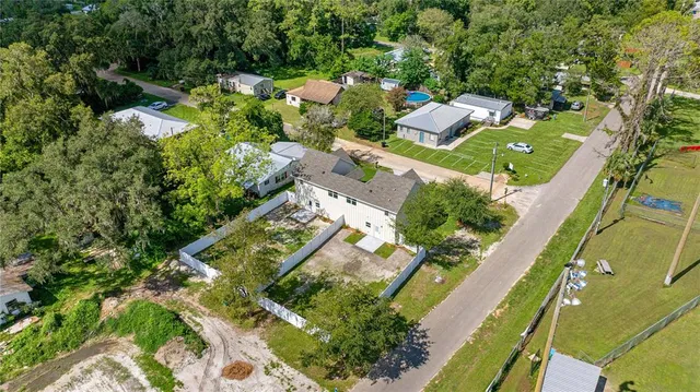 an aerial view of residential houses with outdoor space