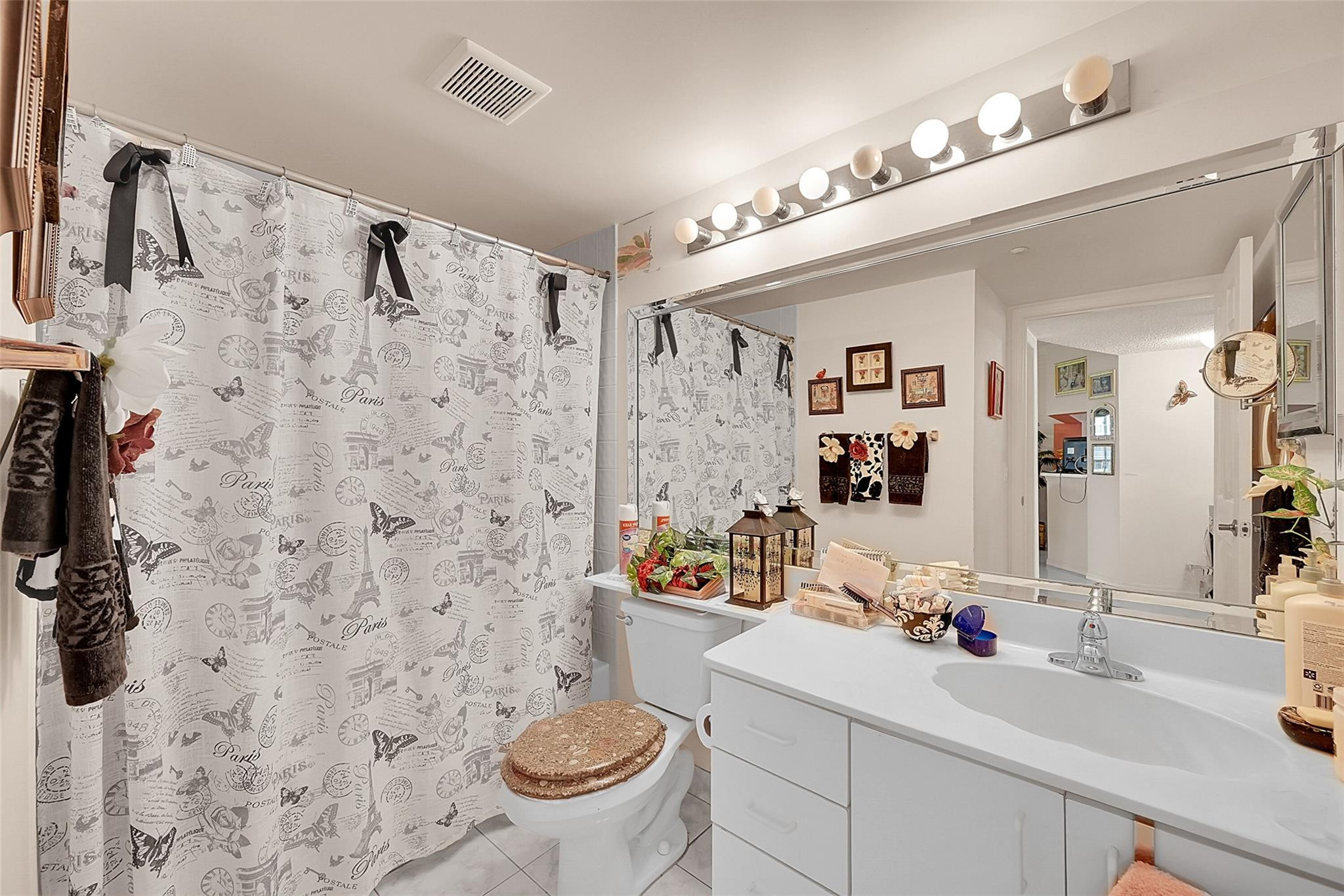 2541 North Nob Hill Road, Unit 206 Sunrise, FL 33322 - Photo 12 of 44 a bathroom with a sink toilet a mirror and shower