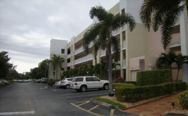 2541 North Nob Hill Road, Unit 206 Sunrise, FL 33322 - Photo 17 of 44 a view of street with parked cars