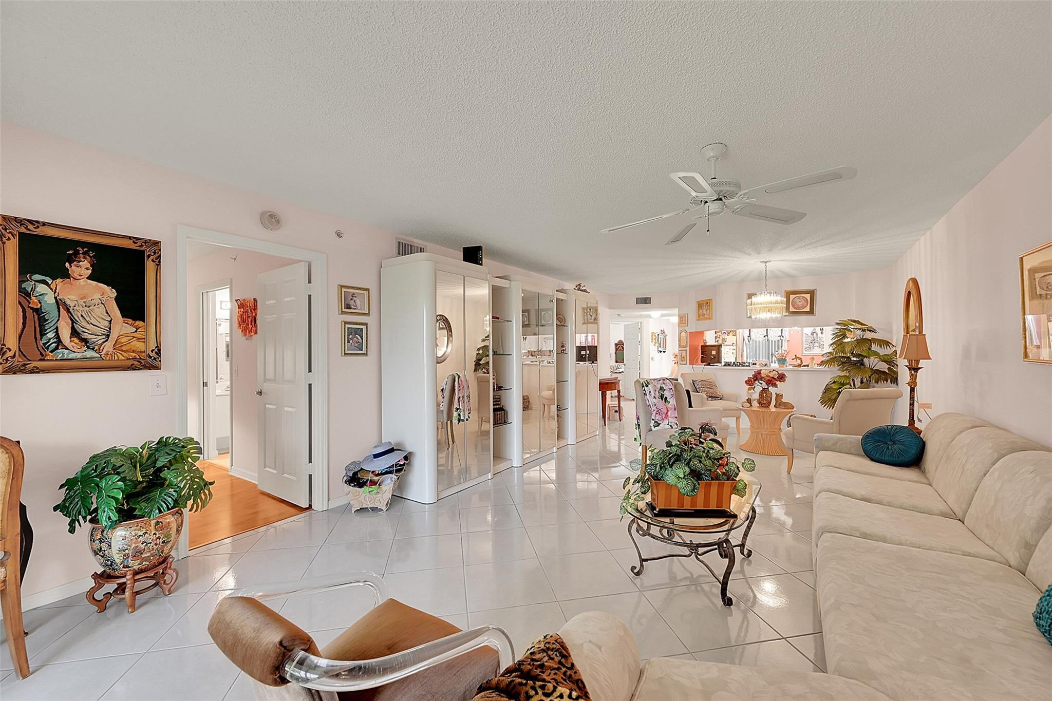 2541 North Nob Hill Road, Unit 206 Sunrise, FL 33322 - Photo 2 of 44 a living room with furniture and a large window