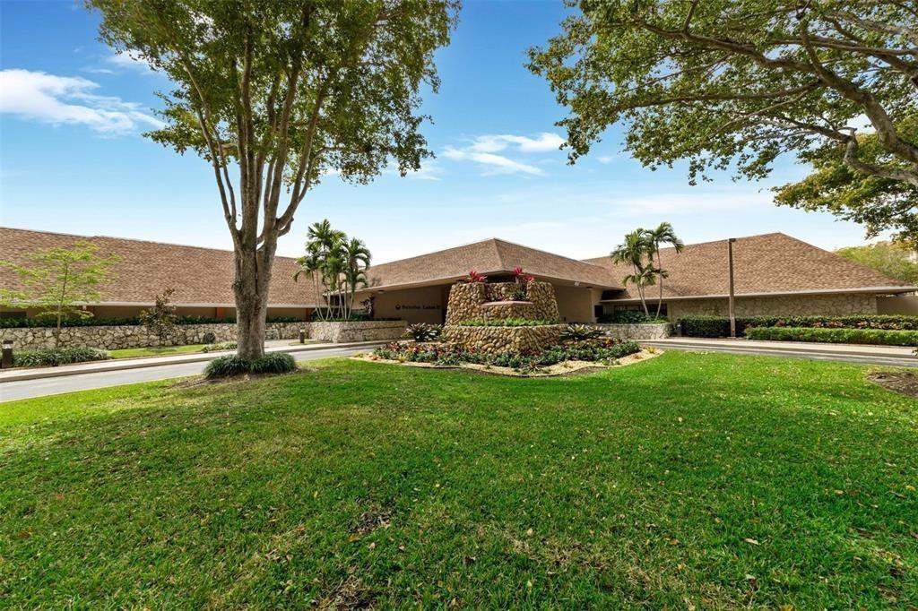 2541 North Nob Hill Road, Unit 206 Sunrise, FL 33322 - Photo 26 of 44 a front view of a house with garden