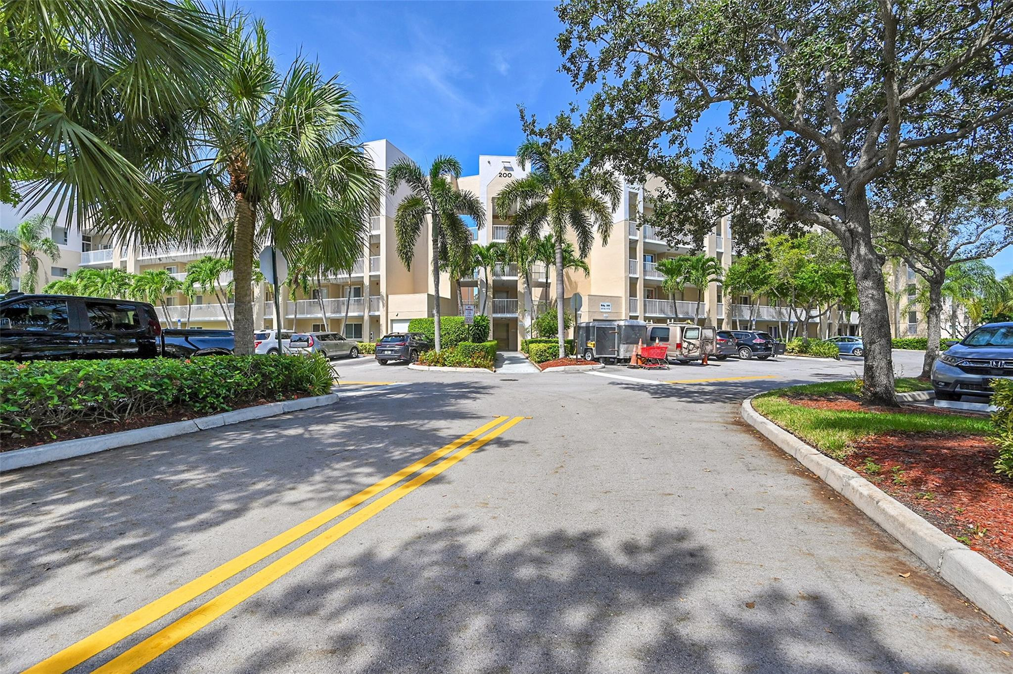 2541 North Nob Hill Road, Unit 206 Sunrise, FL 33322 - Photo 44 of 44 a view of road with palm trees