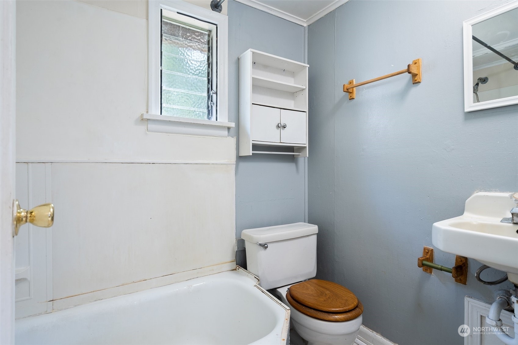 2515 Rocky Point Road Northwest Bremerton, WA 98312 - Photo 15 of 29 a white toilet sitting next to a bathroom sink and vanity