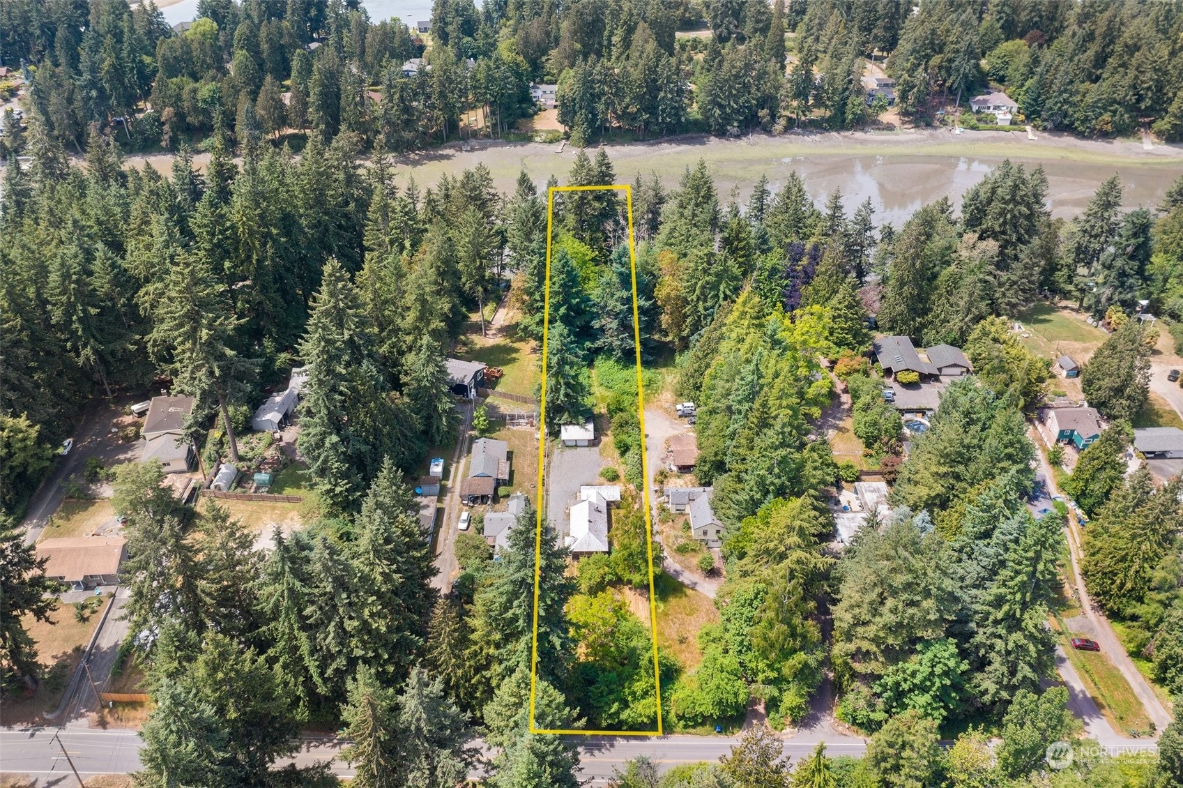 2515 Rocky Point Road Northwest Bremerton, WA 98312 - Photo 2 of 29 an aerial view of residential house with outdoor space and trees all around