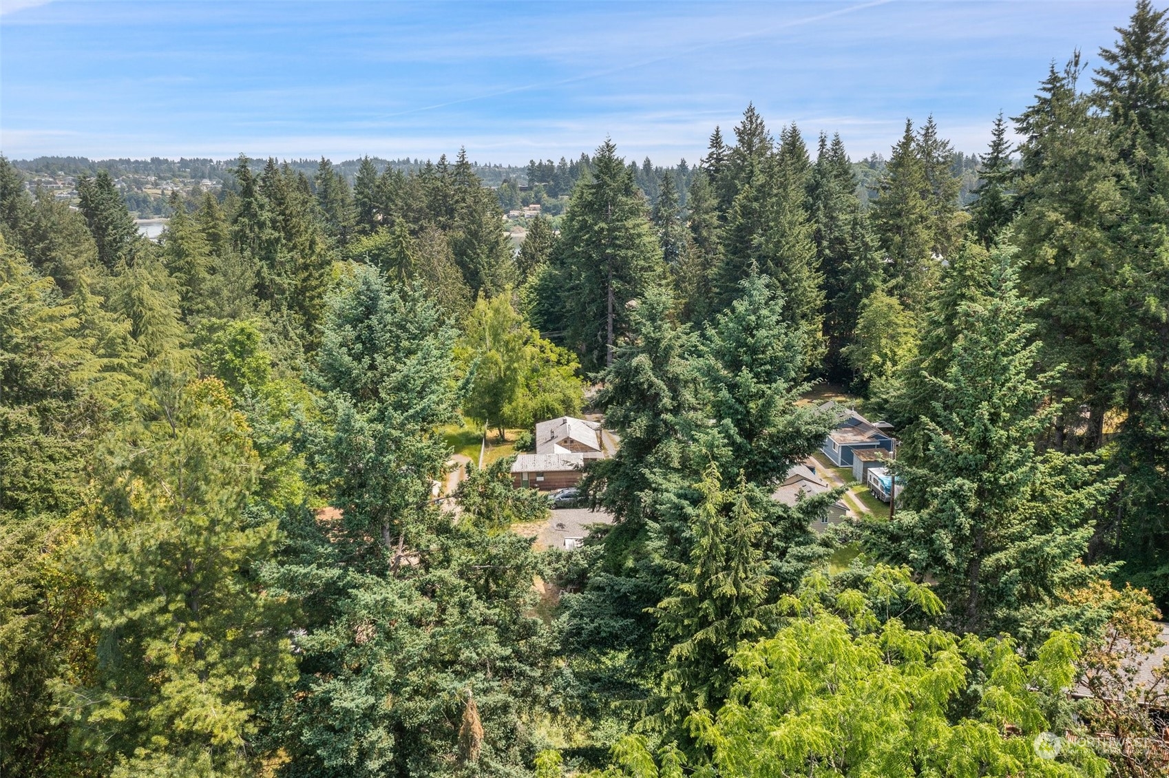 2515 Rocky Point Road Northwest Bremerton, WA 98312 - Photo 28 of 29 a view of a city with lush green forest