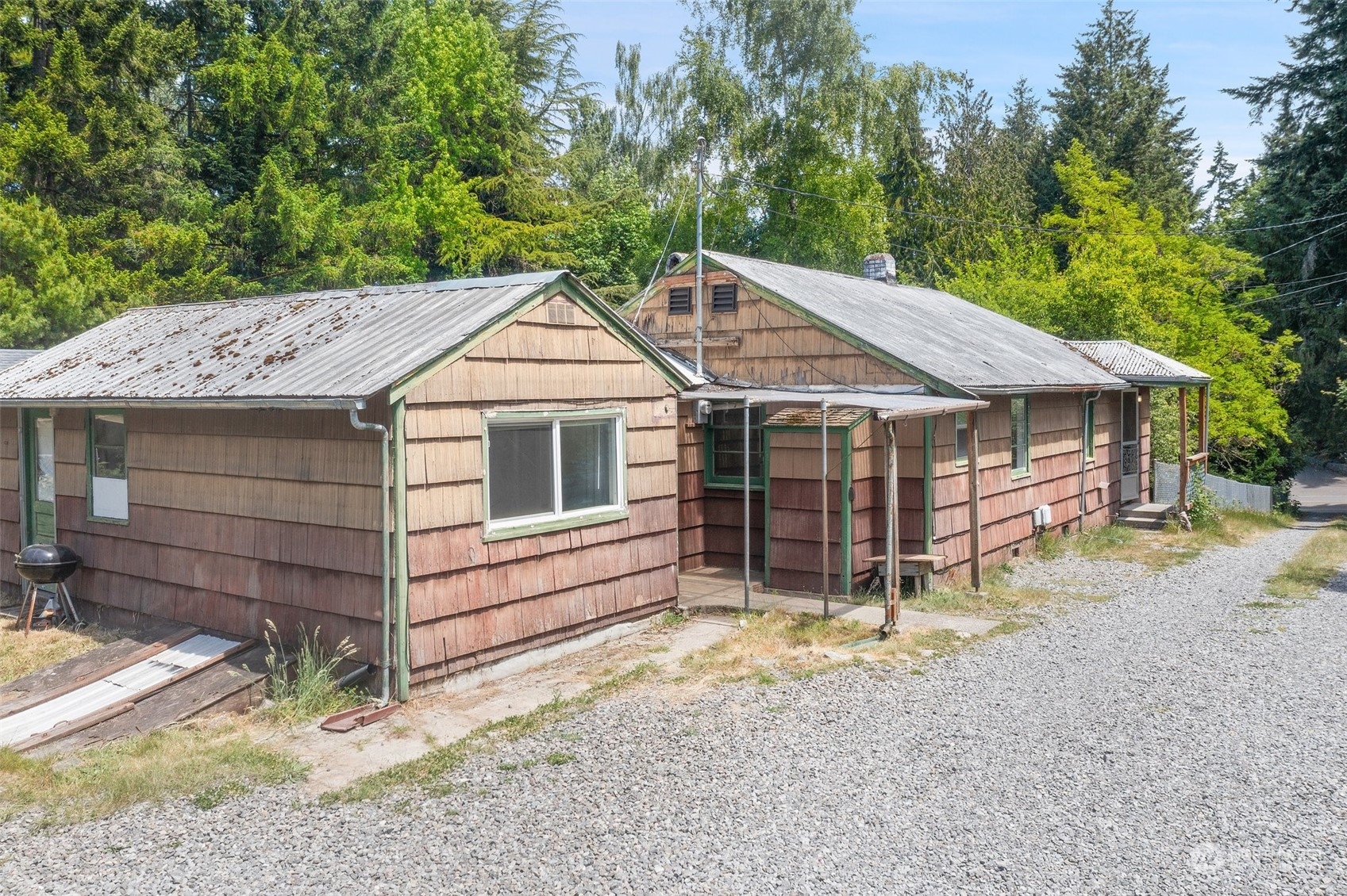 2515 Rocky Point Road Northwest Bremerton, WA 98312 - Photo 3 of 29 a house with a yard
