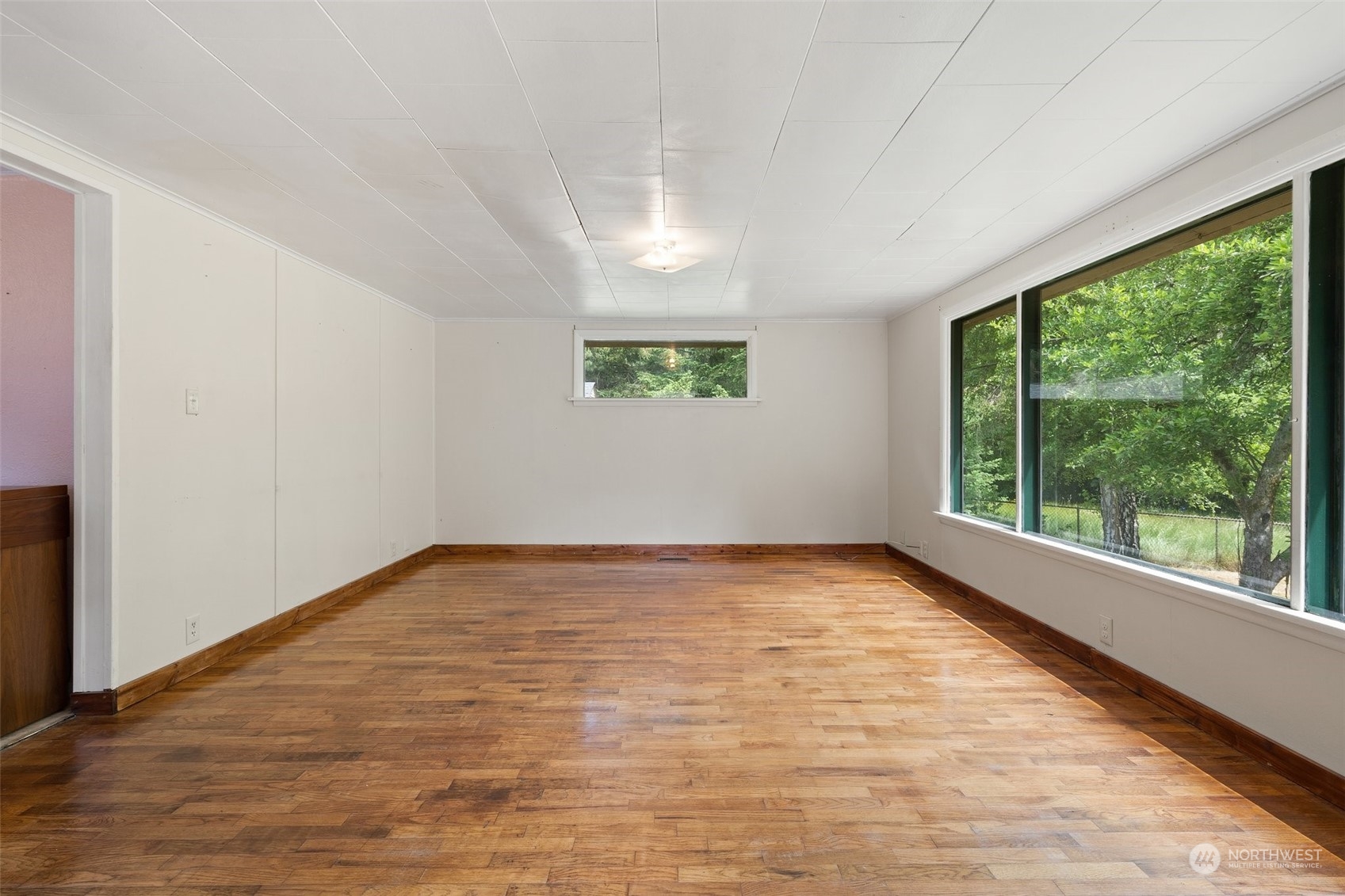 2515 Rocky Point Road Northwest Bremerton, WA 98312 - Photo 4 of 29 a view of an empty room with a window