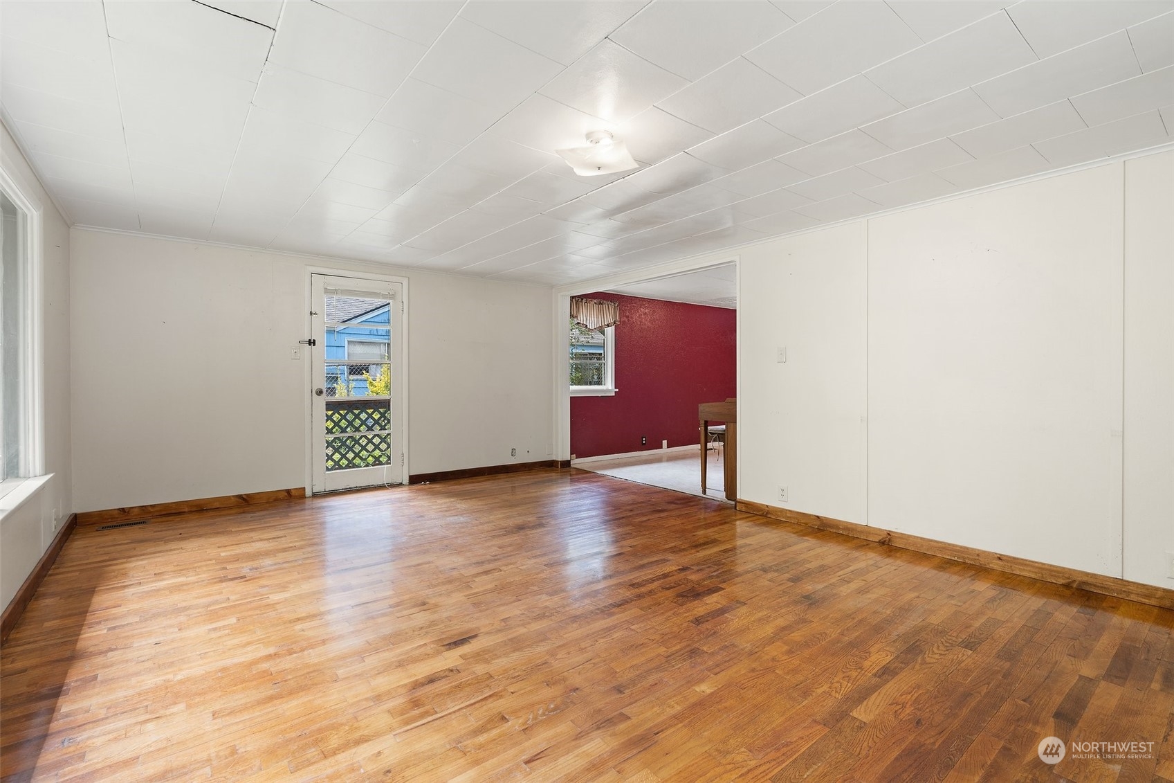 2515 Rocky Point Road Northwest Bremerton, WA 98312 - Photo 5 of 29 a view of an empty room with wooden floor