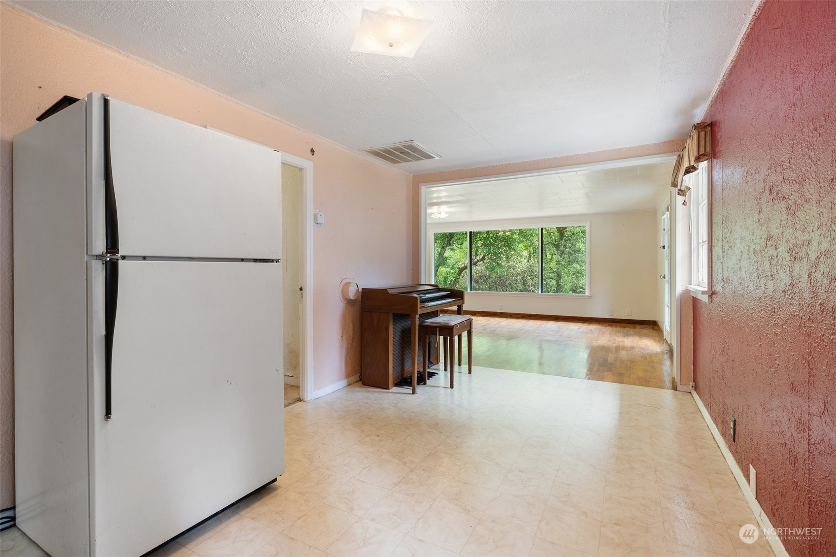 2515 Rocky Point Road Northwest Bremerton, WA 98312 - Photo 9 of 29 a view of kitchen with furniture and a refrigerator