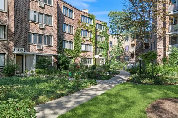 a view of a building with a yard