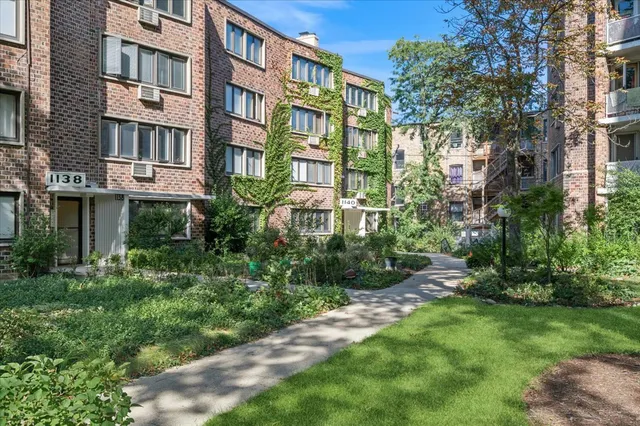 a view of a building with a yard