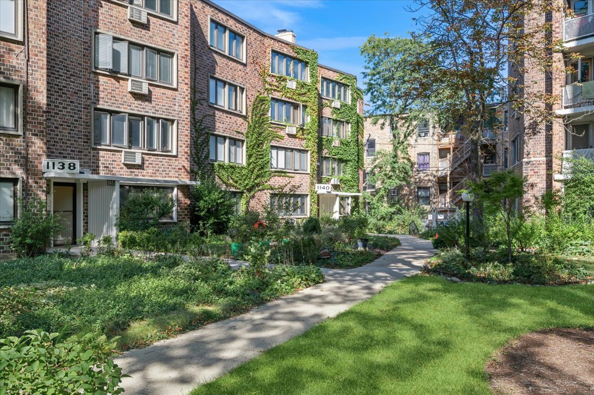 a view of a building with a yard