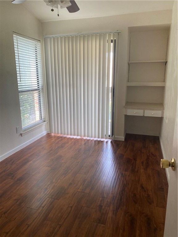 612 Park Place, Unit 301 Austin, TX 78705 - Photo 19 of 25 a view of empty room with wooden floor and fan