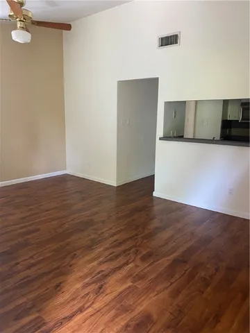 a view of a livingroom with wooden floor