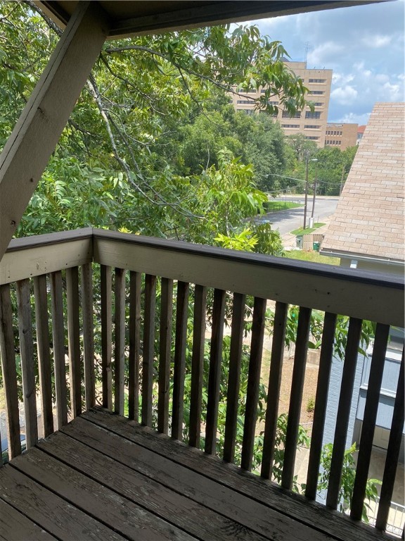 612 Park Place, Unit 301 Austin, TX 78705 - Photo 22 of 25 a view of a wooden balcony