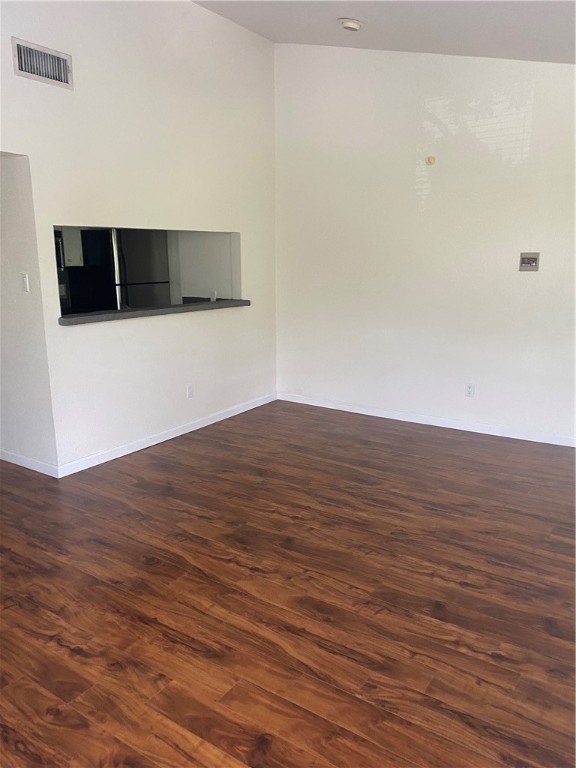612 Park Place, Unit 301 Austin, TX 78705 - Photo 4 of 25 a view of an empty room with wooden floor