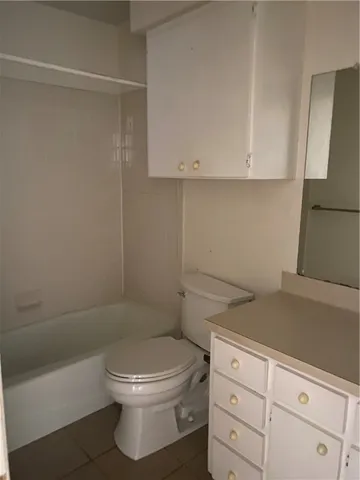 a bathroom with a toilet a sink and shower