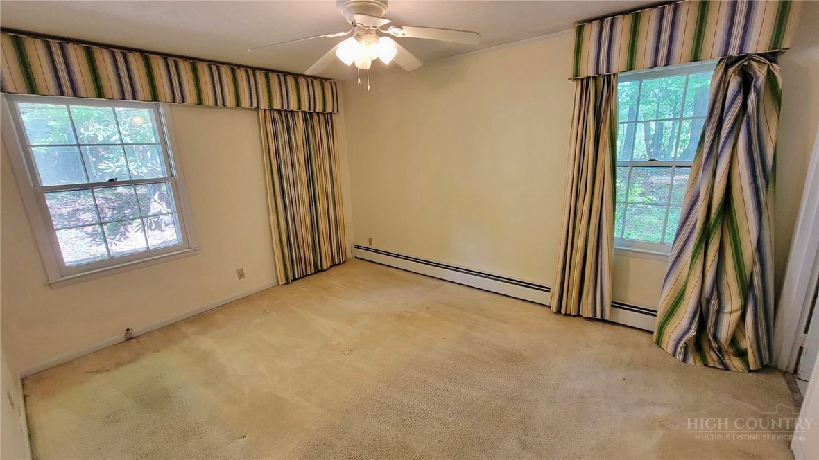 247 Crest Drive Boone, NC 28607 - Photo 10 of 19 an empty room with windows