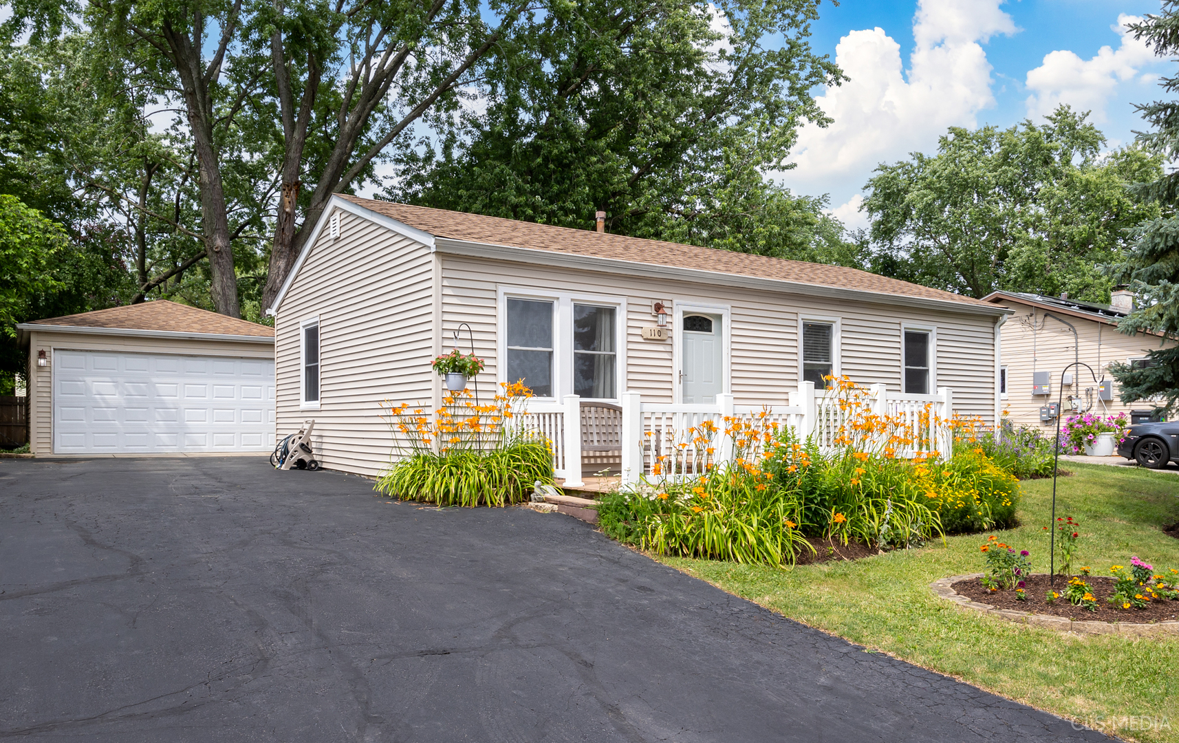 a front view of a house with a yard and porch
