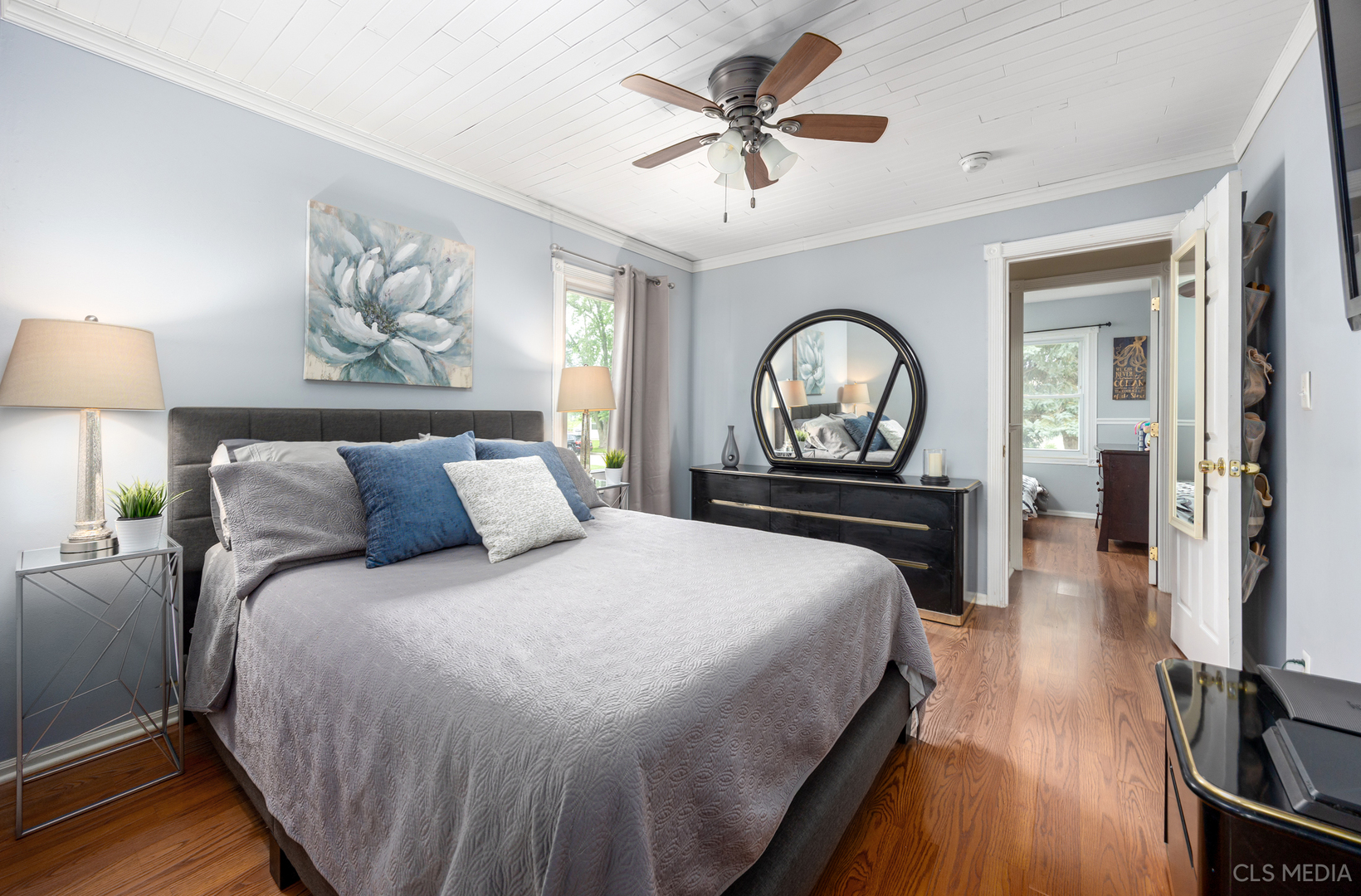 110 Cedar Circle Streamwood, IL 60107 - Photo 12 of 28 a bedroom with a large bed and a chandelier