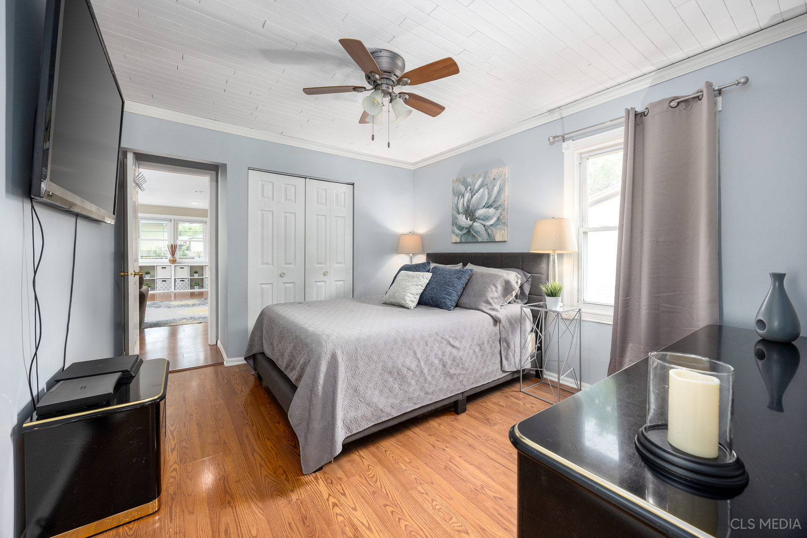 110 Cedar Circle Streamwood, IL 60107 - Photo 13 of 28 a bedroom with a bed and wooden floor