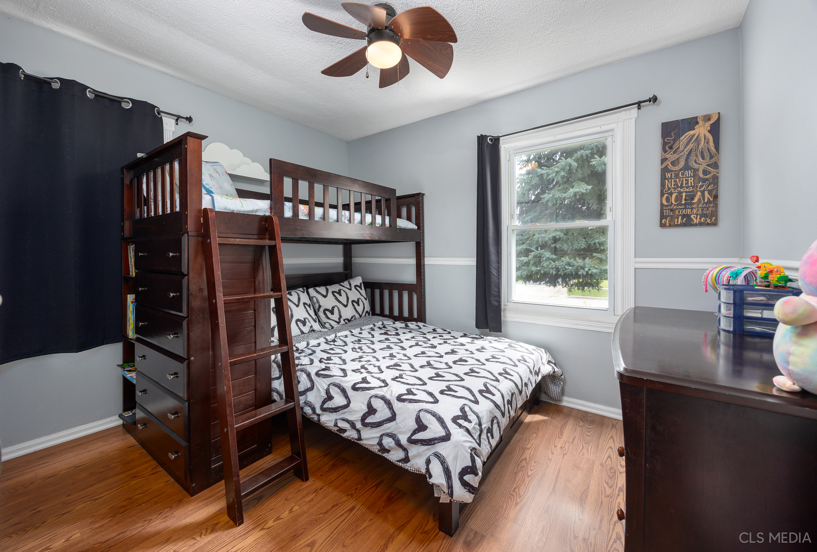 110 Cedar Circle Streamwood, IL 60107 - Photo 16 of 28 a bedroom with a bed chandelier and a window