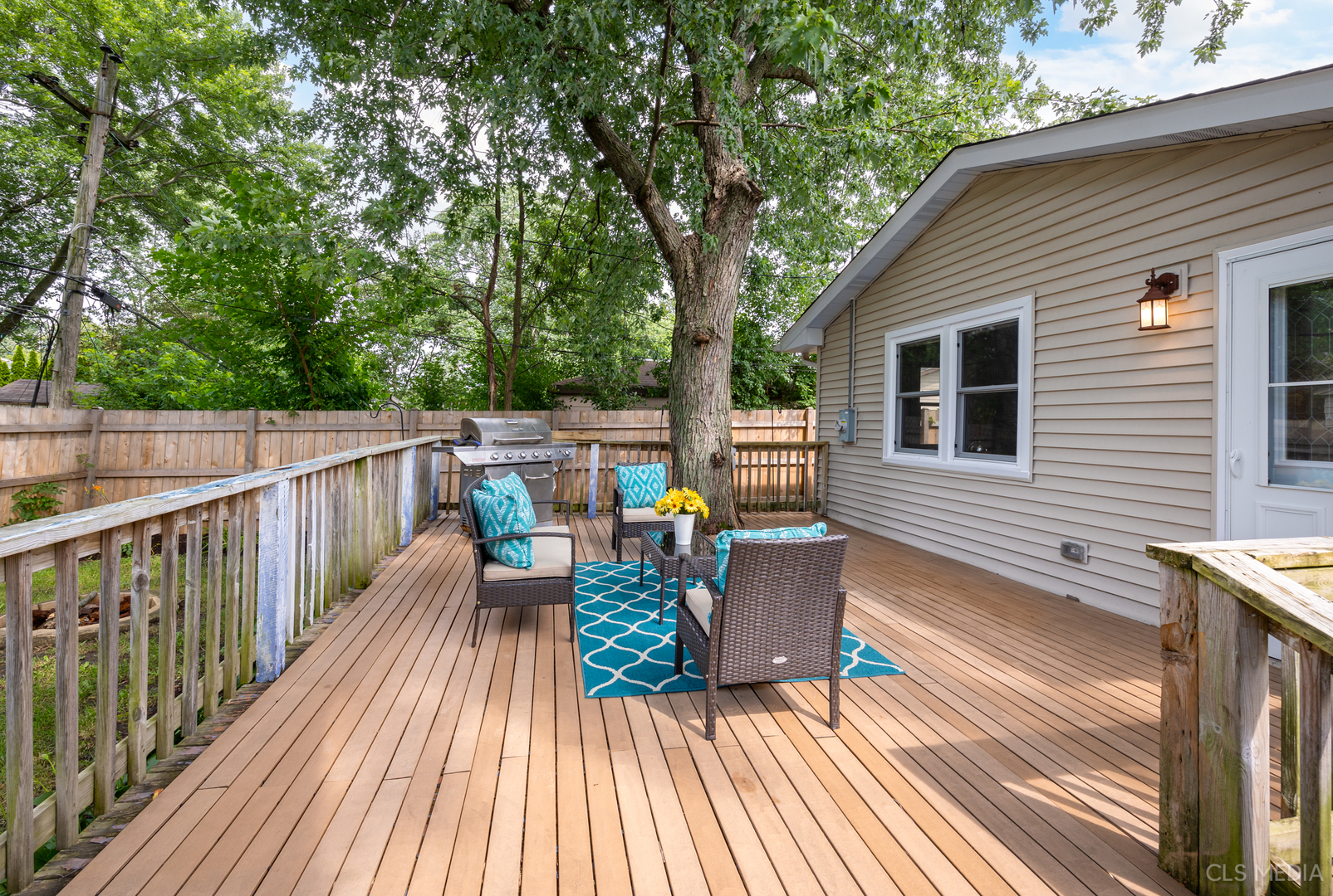 110 Cedar Circle Streamwood, IL 60107 - Photo 21 of 28 a view of deck with table and chairs wooden floor and fence