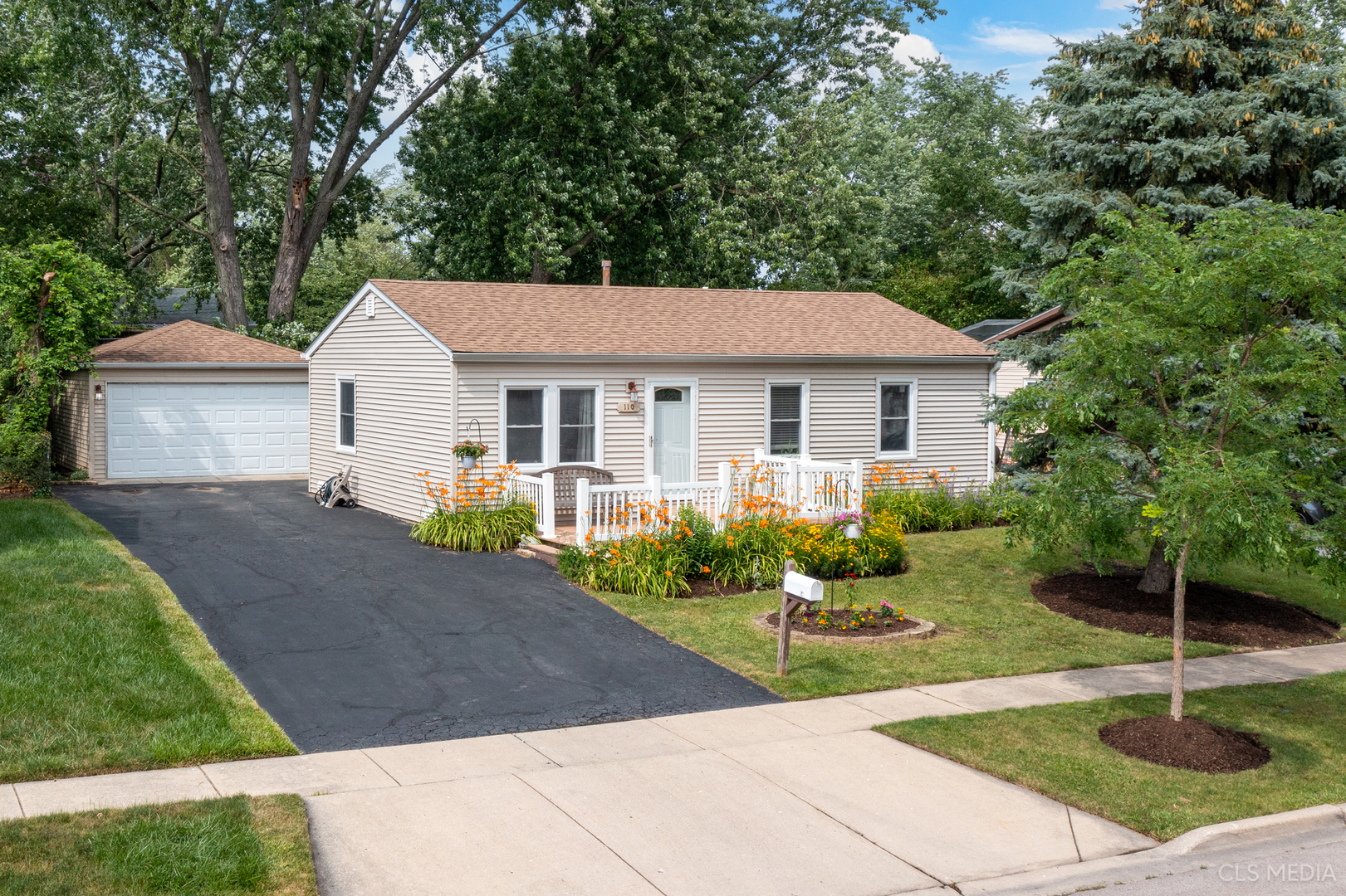 110 Cedar Circle Streamwood, IL 60107 - Photo 27 of 28 a front view of a house with garden