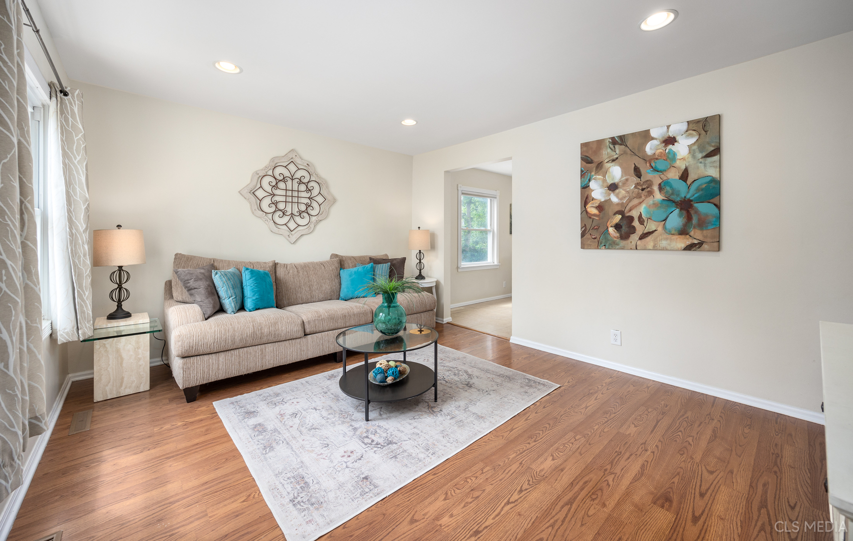 110 Cedar Circle Streamwood, IL 60107 - Photo 3 of 28 a living room with furniture and wooden floor